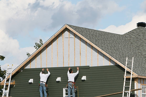 Professional Siding technician working in Dorchester Center, MA